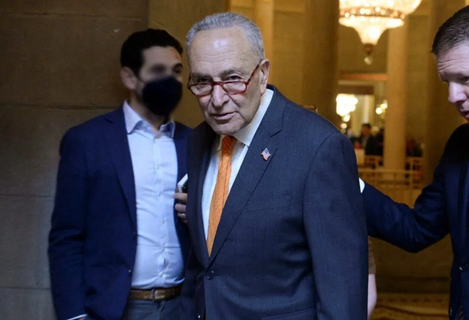 Senior leader walking in formal attire in a hallway setting