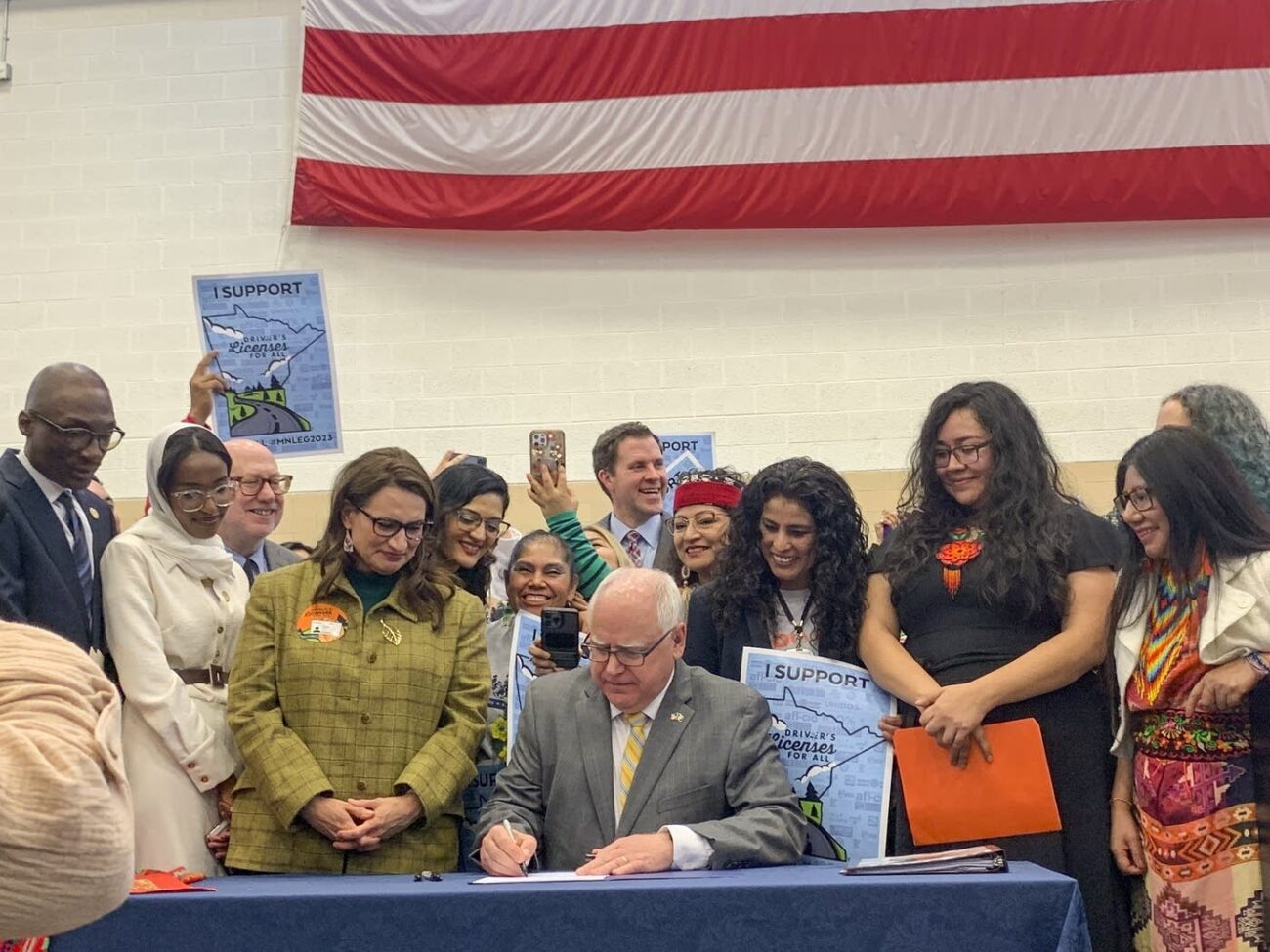 Group gathered as official signs important document