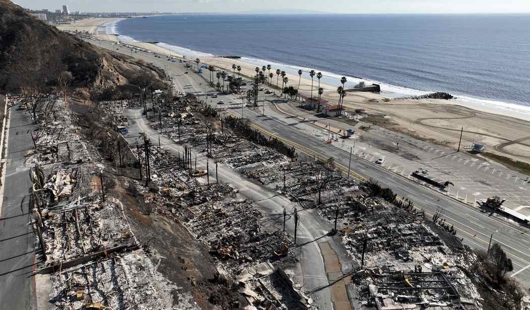 Aerial view of fire devastation near coastal highway and beach
